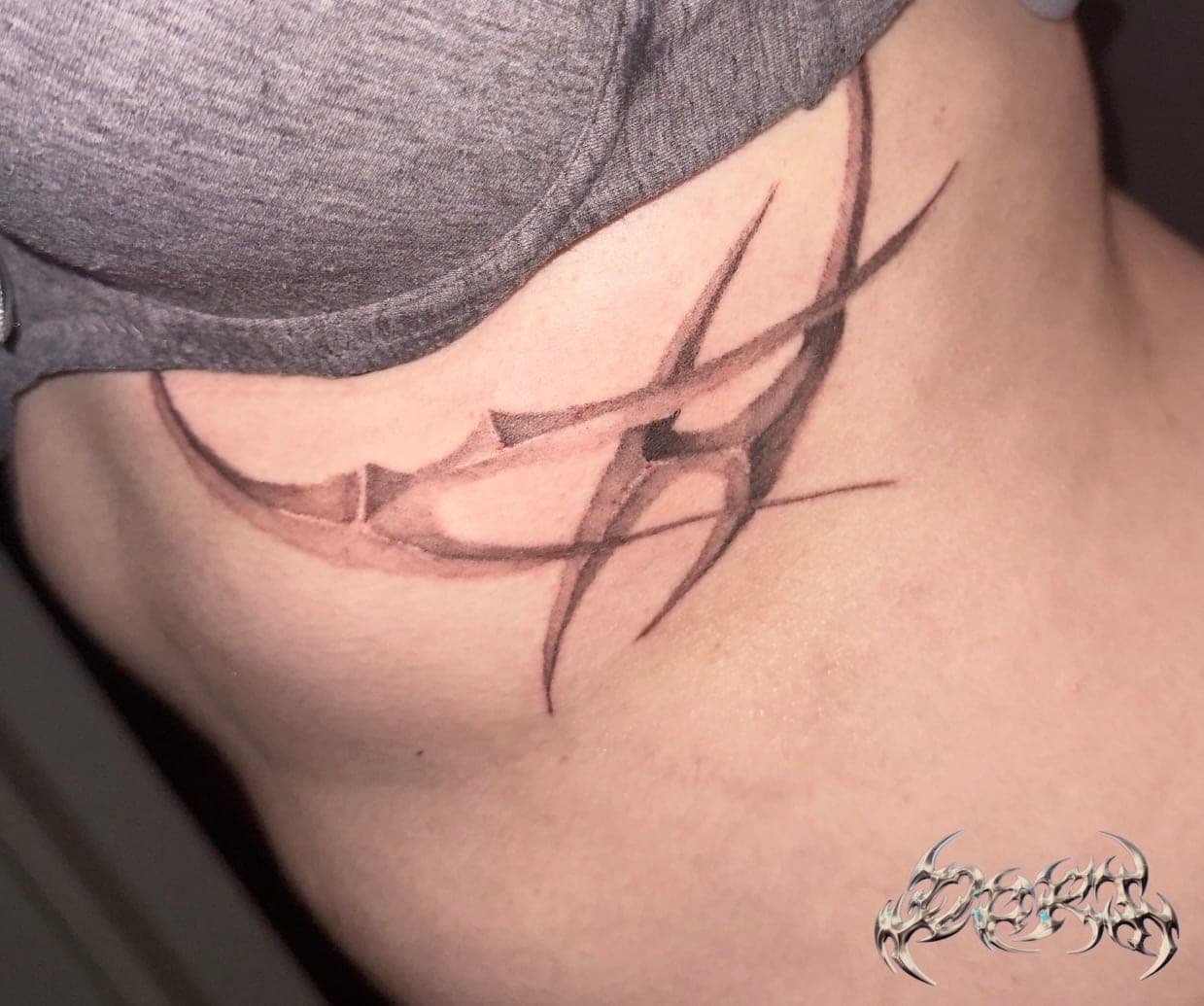 Chrome effect tattoo on ribs