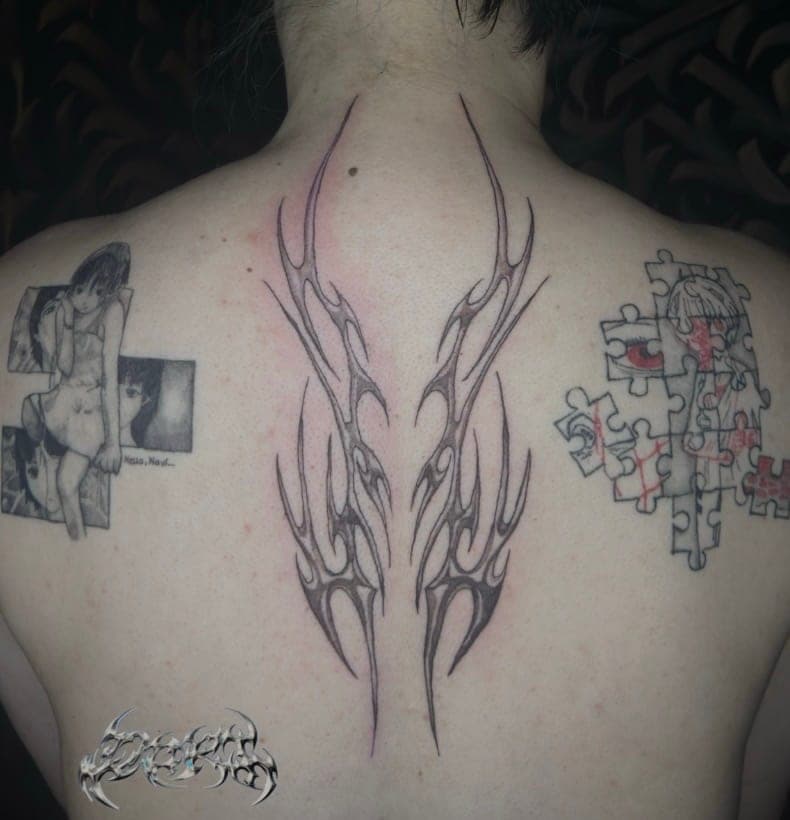 Chrome effect back tattoo