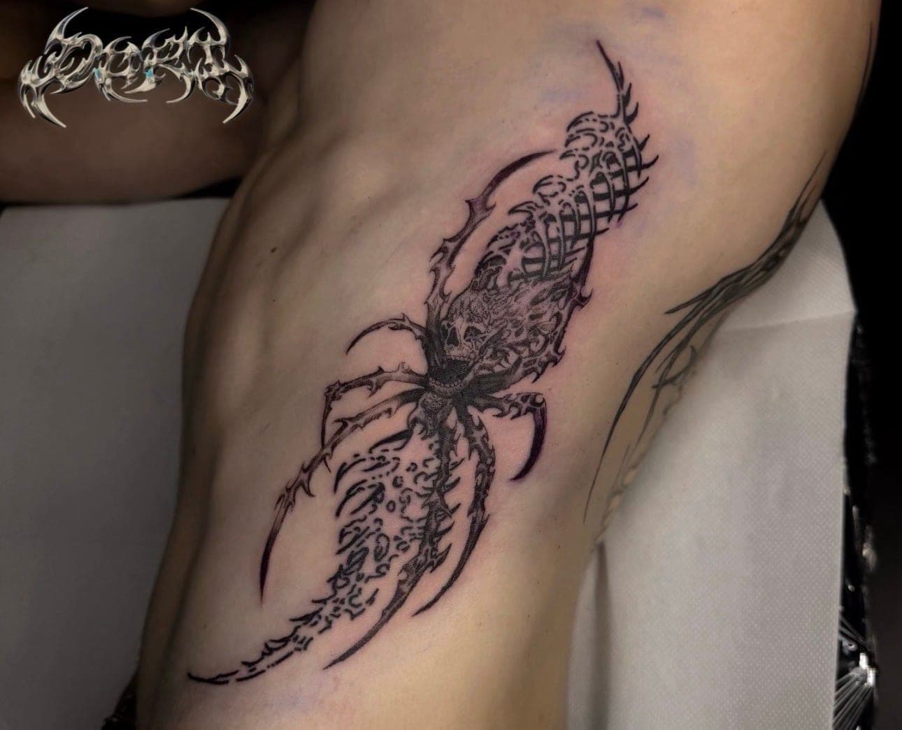 Cybersigilism tattoo on ribs